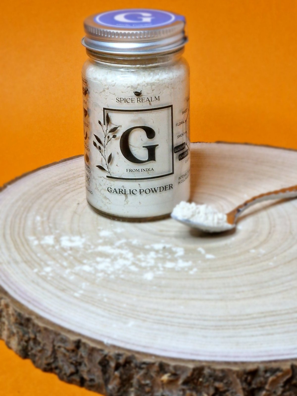 Jar of organic Garlic Powder, displaying its off-white colour and fine, granular texture