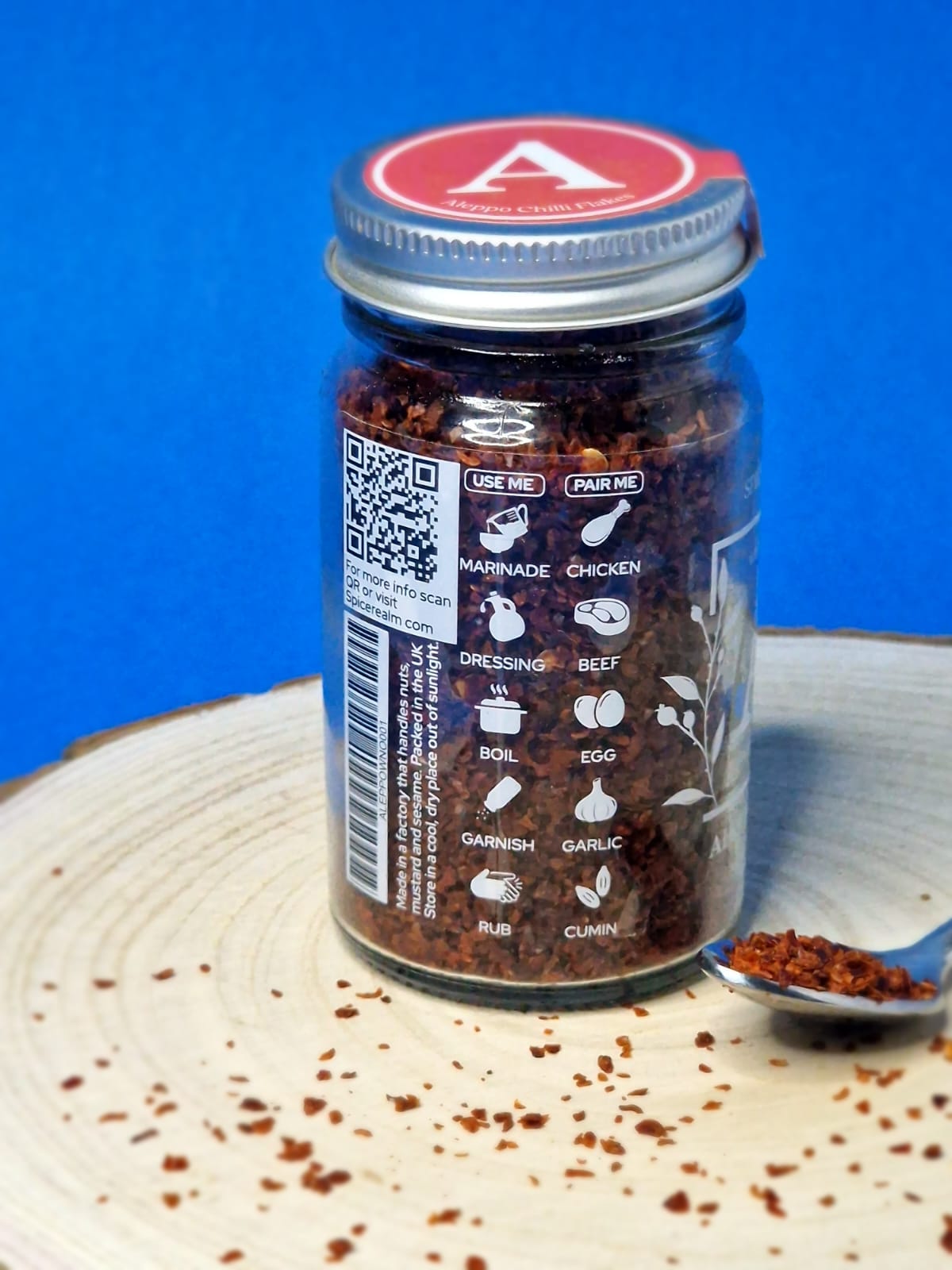 Image showing Aleppo chilli flakes, ideal for adding a mild, fruity heat to dishes like pizza, salads, and roasted vegetables, with their rich red hue and coarse texture.