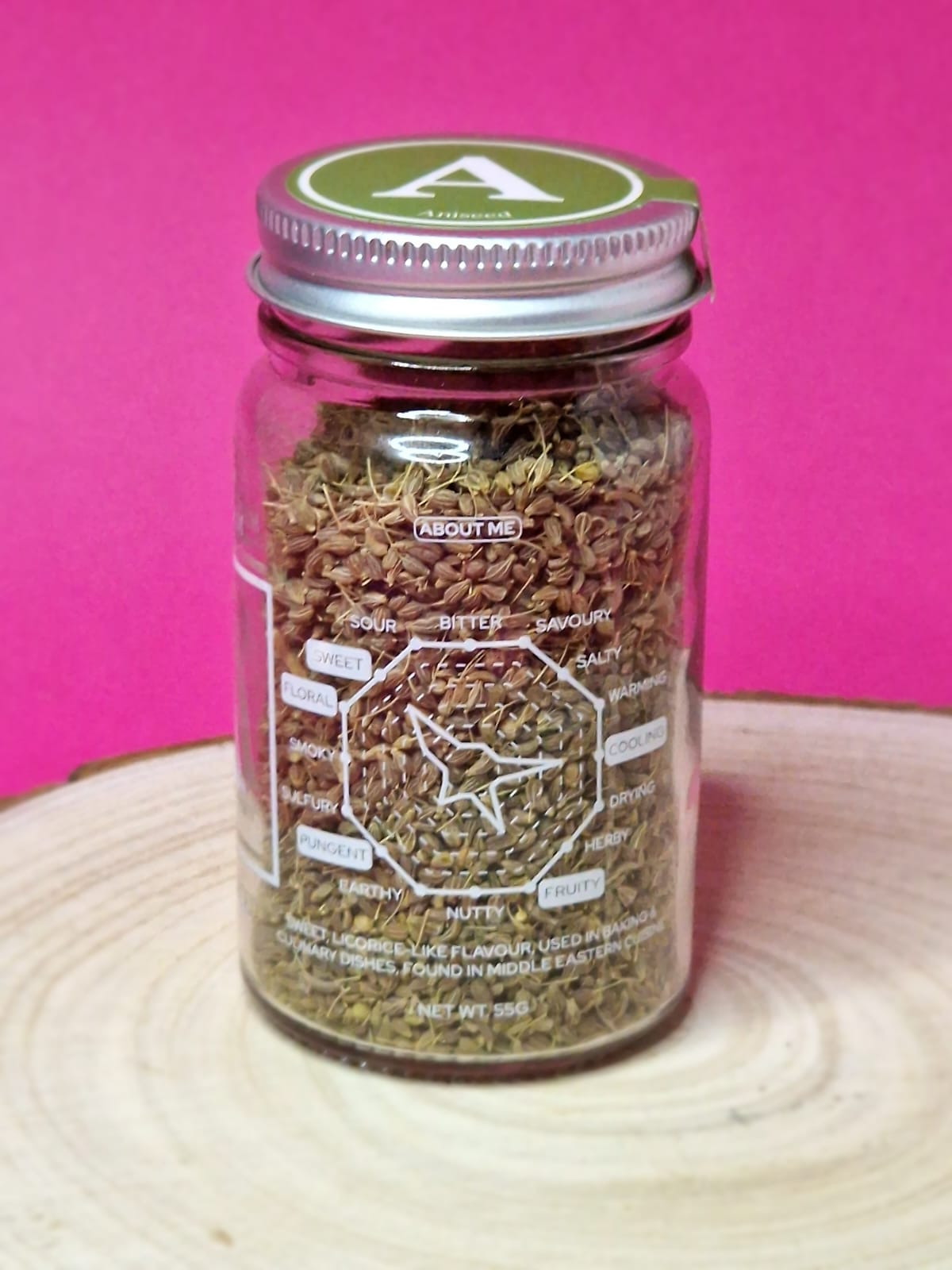 Image of aniseed, showing its small, oval shape and brown colour. Known for its sweet, liquorice-like flavour, aniseed is used in a variety of baked goods, teas, and savoury dishes.