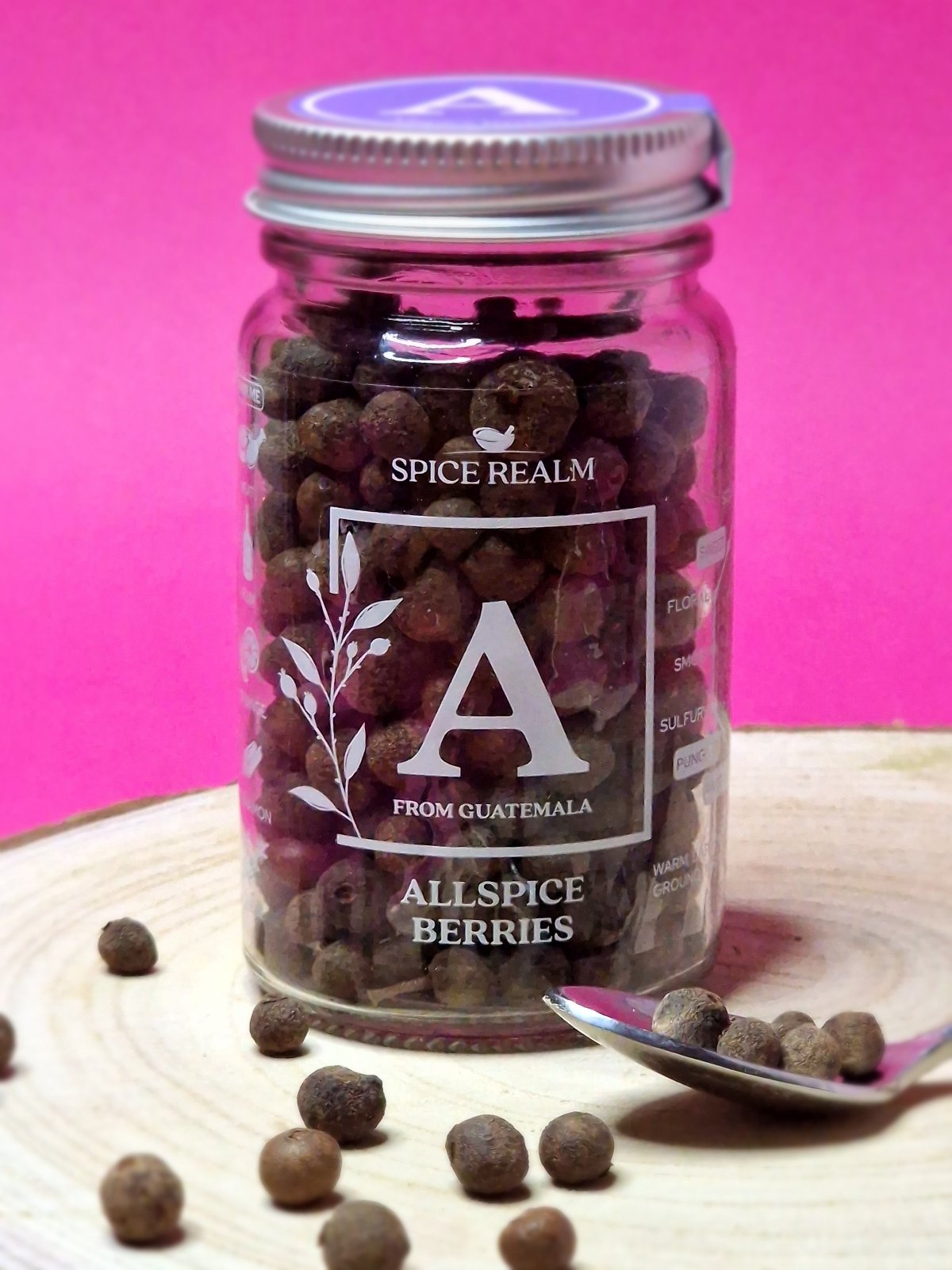 Image of whole allspice berries, displaying their round, dark brown appearance, known for adding warm, aromatic flavours to both sweet and savoury dishes.