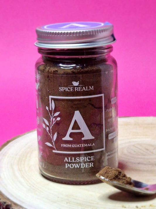 Image of allspice powder, featuring its fine, brown texture. This aromatic spice offers a warm blend of cinnamon, cloves, and nutmeg flavours, perfect for enhancing both sweet and savoury recipes.