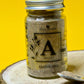 Image of asafoetida, a fine yellowish powder with a pungent aroma, commonly used in Indian cooking to add a strong, savoury flavour to curries, dals, and vegetable dishes.