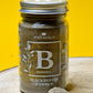 Jar of organic Black Pepper Powder, exhibiting its dark grey colour and fine, speckled texture.