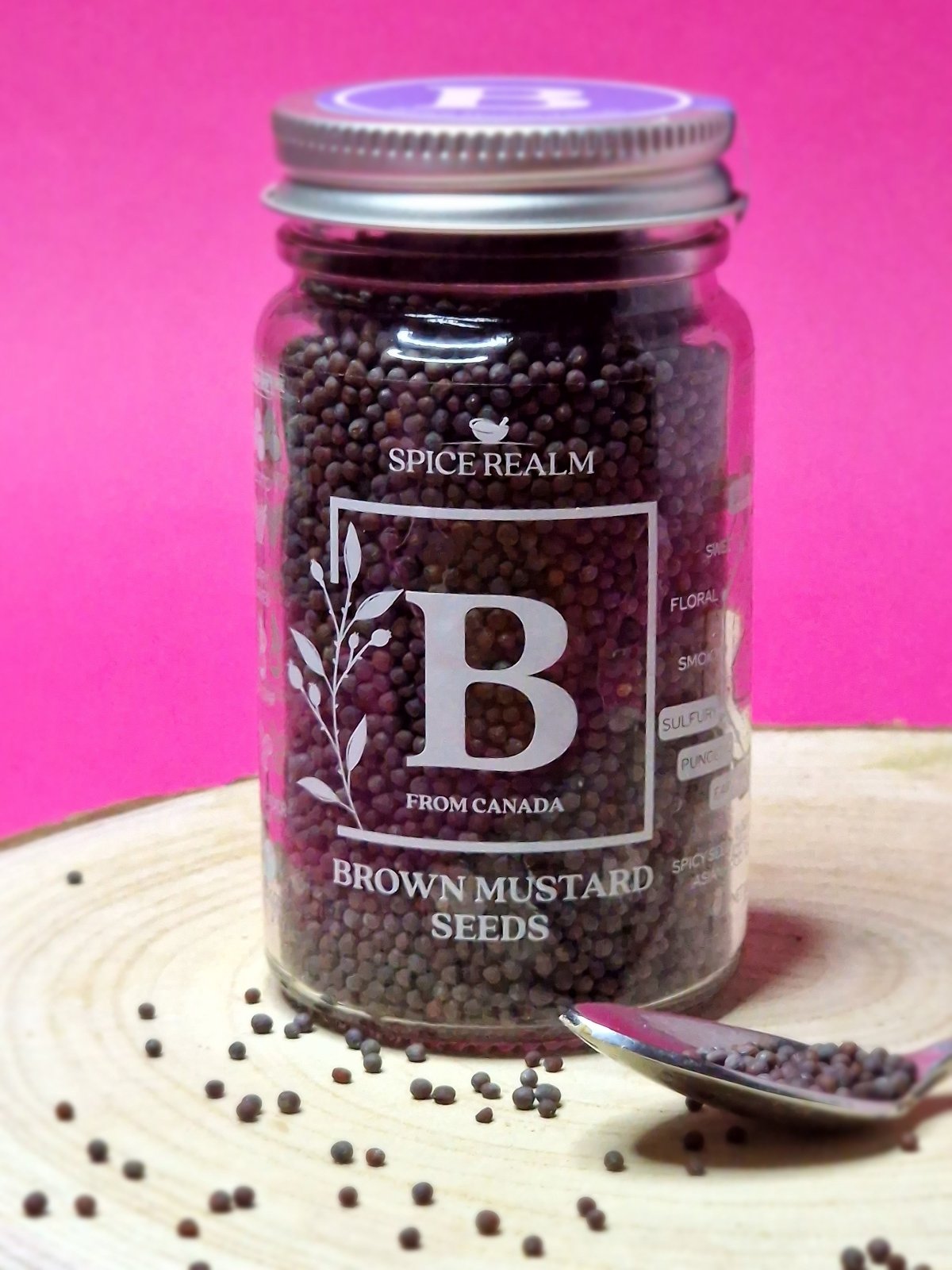 Jar of organic Brown Mustard Seeds, displaying their small, round shape and rich brown colour