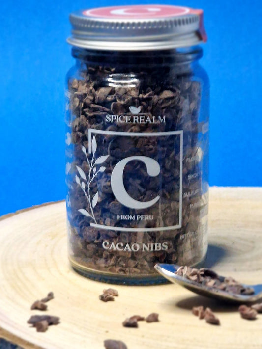 Jar of organic Cacao Nibs, showcasing their dark brown colour and crunchy, irregular shapes