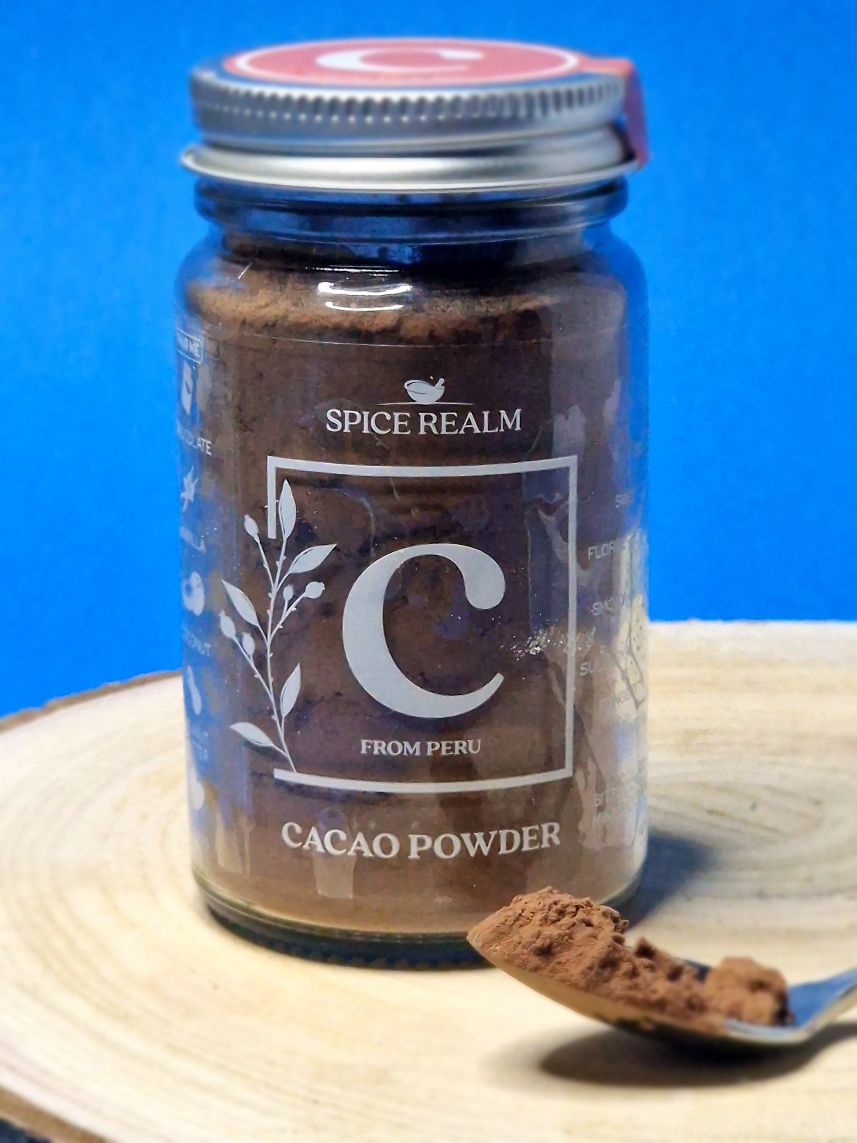 Jar of organic Cacao Powder, displaying its rich, dark brown colour and fine texture