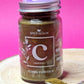 Jar of organic Cumin Powder, showcasing its warm brown colour and fine, powdery consistency