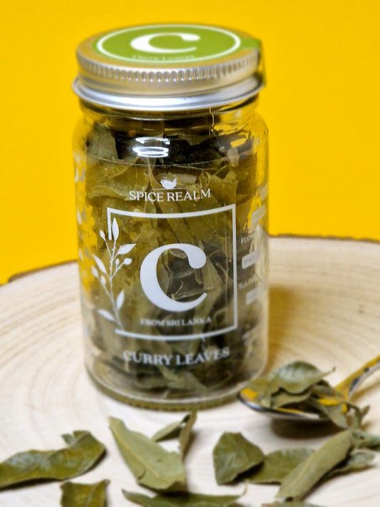 Jar of dried organic Curry Leaves, showing their small, oval shape and deep green colour