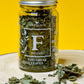 Jar of dried organic Fenugreek Leaves, displaying their small, delicate appearance and muted green colour