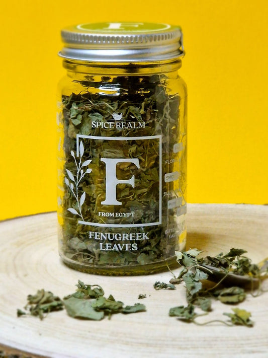 Jar of dried organic Fenugreek Leaves, displaying their small, delicate appearance and muted green colour