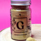 Jar of organic Ginger Powder, exhibiting its pale yellow colour and fine, powdery consistency