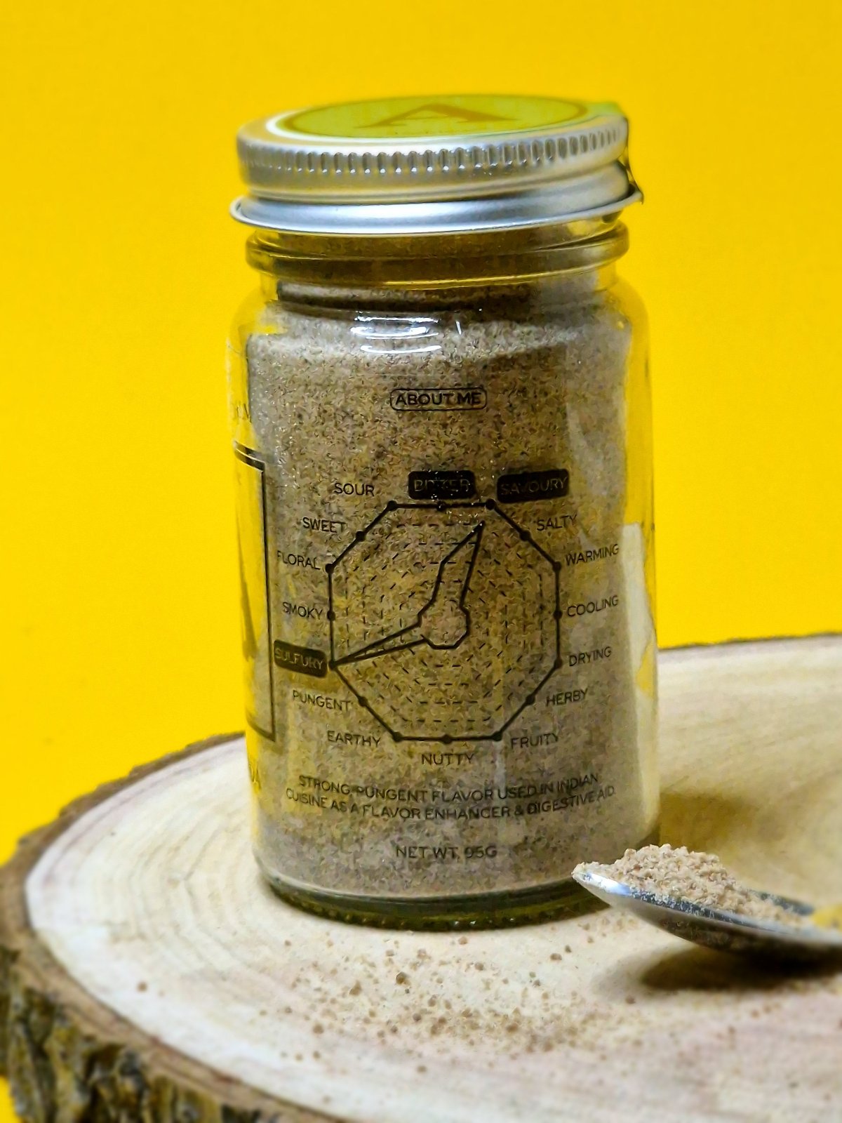 Image of asafoetida powder, displaying its pale yellow colour. Known for its pungent aroma and strong savoury flavour, it is widely used in Indian cuisine to enhance curries, dals, and vegetarian dishes.