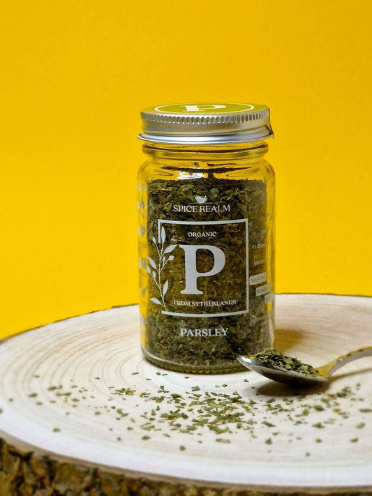 Jar of dried organic Parsley, displaying its finely chopped leaves and vibrant green colour